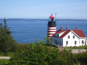 lighthouse with water in background