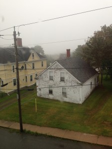 two houses partially covered with fog