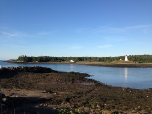 sand in foreground with island in background