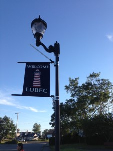 welcome to lubec sign on lamp post