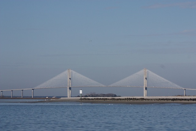 open water in foreground bridge in background