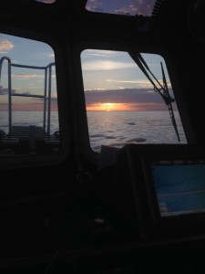 sunset on water taken through boat window