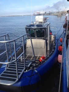 blue boat next to dock