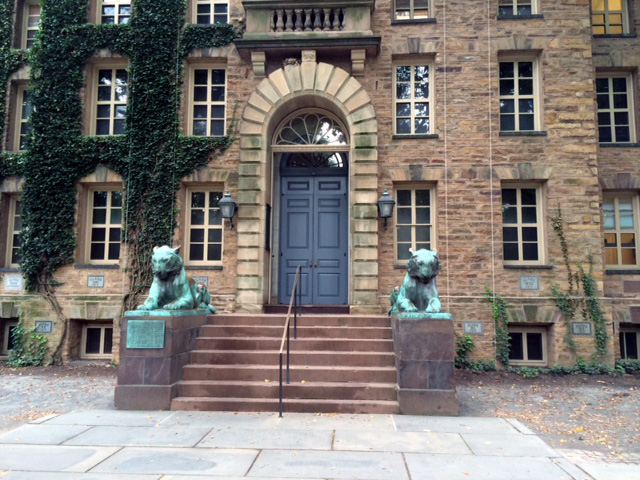 entrance to building with lion statues on sides